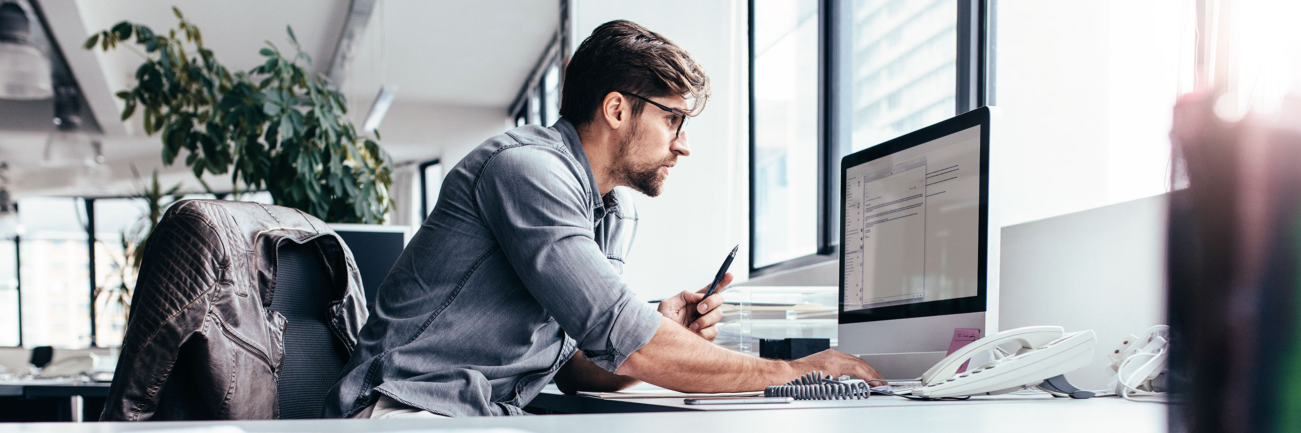 man infront of computer